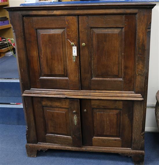 A small oak press cupboard W.113cm